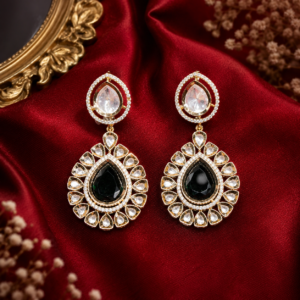 Gold-plated Kundan drop earrings featuring a deep green pear-cut center stone surrounded by clear CZ cubic zirconia halo work by Glorious Jewels.