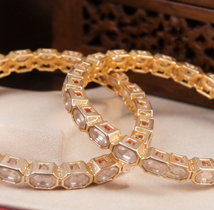 Premium gold finish uncut Kundan bangles for women by Glorious Jewels perfect for bridal wedding festive and party wear.