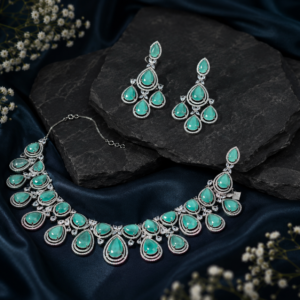 American Diamond rhodium necklace featuring two rows of pear-cut mint green stones encircled by micro-pave CZ halos with marquise crystal accents from Glorious Jewels.