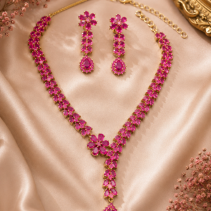 lariat-style necklace featuring a double band of marquise-cut ruby pink crystals centering on a floral bloom motif with a cascading teardrop pendant from Glorious Jewels.