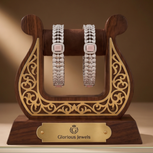 Silver-tone American Diamond kadas with baby pink stones.